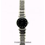 *Ladies' Longines La Grande Classique wristwatch, circular black dial with diamond dot hour markers,