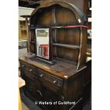 Oak dresser with shaped plate rack above twin drawers and cupboards, 120 x 46 x 70cm