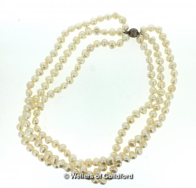 Three row baroque pearl necklace, with silver ball clasp, length 44cm