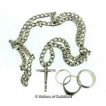 *Three rings and a cross and chain in white metal tested as silver, gross weight 65.3 grams (Lot