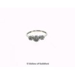 Diamond cluster ring, round brilliant cut diamonds set in three floral clusters, weighing an