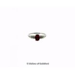 Rubellite and diamond ring, central oval cut rubellite, weighing an estimated 0.85ct, with three