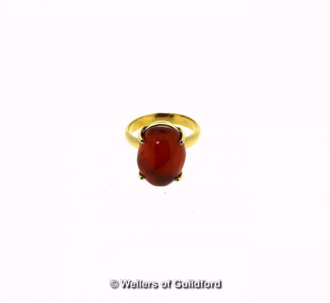 *Carnelian ring, oval cabochon cut carnelian, mounted in yellow metal tested as 18ct, ring size L (