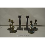 Pair of Arts and Crafts pewter candlesticks, together with two pairs of brass candlesticks