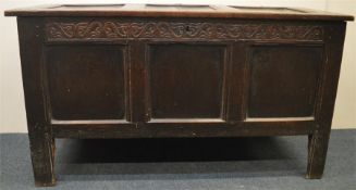 An Antique carved tilt top coffer with carved fron