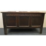 An Antique carved tilt top coffer with carved fron