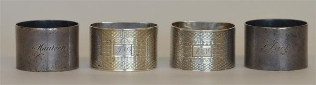 Two pairs of heavy silver napkin rings with initia