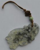 A hard stone pendant with loop top and ball decora
