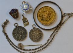 An unusual silver pendant together with medallions