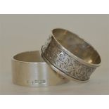 Two heavy napkin rings with engraved decoration. A