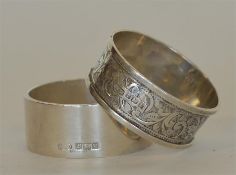 Two heavy napkin rings with engraved decoration. A