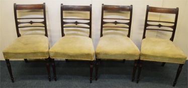 A set of four Georgian mahogany chairs with slip i