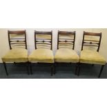 A set of four Georgian mahogany chairs with slip i