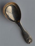A small fiddle pattern caddy spoon with shell term