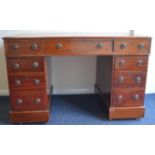 A good Edwardian twin pedestal writing desk on pan