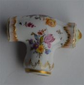 An attractive porcelain cane handle decorated with