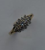 A small diamond cluster ring in 9 carat gold. Appr
