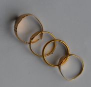 A heavy group of gold band rings. Approx. 13.8 gra