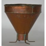 An unusual copper chicken feeder. Est. £20 - £30.