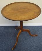 An Antique mahogany table on pedestal base. Est. £