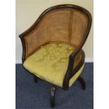 A mahogany swivel top office chair with pane back.