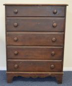 A mahogany chest of five drawers on bracket feet.