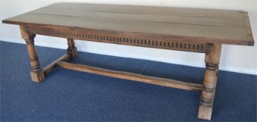 A massive plank top refectory table on turned supp