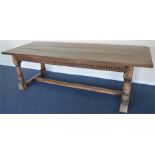 A massive plank top refectory table on turned supp