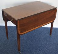 A mahogany Pembroke table on tapering supports. Es