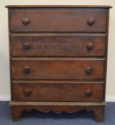 A mahogany chest of four drawers on bracket feet.