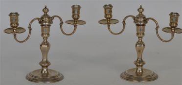 A good pair of cast candelabra mounted with four