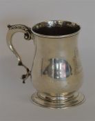 A heavy Georgian pint mug of baluster form. London