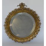 An attractive brass circular wall mirror. Est. £30