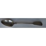 A heavy silver fiddle and thread basting spoon. Lo