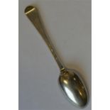 An early Georgian bottom marked spoon with shell d