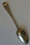 An early Georgian bottom marked spoon with shell d