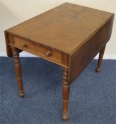 A mahogany Pembroke table on turned supports. Est.