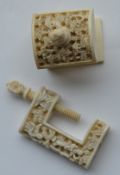 Two 19th Century carved ivory sewing clamps. Est.