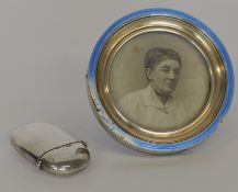 A heavy oval vesta case together with a picture fr