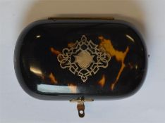 An attractive tortoiseshell and gold inlaid purse