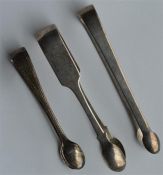 A group of three pairs of silver sugar tongs with