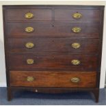 An oak chest of five drawers on bracket feet. Est.