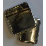 A good Oriental silver cigarette holder decorated