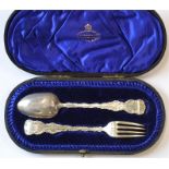 An attractive cased christening spoon and fork wit