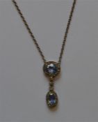 An attractive diamond mounted pendant on fine link