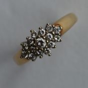 A small diamond circular cluster ring in 9 carat c