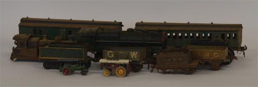 An old mechanical train together with carriages. E