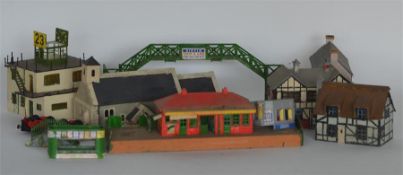 A collection of toy houses. Est. £20 - £30.