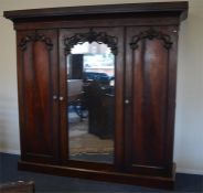 A good mahogany triple door wardrobe on pedestal b