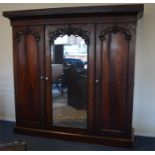 A good mahogany triple door wardrobe on pedestal b